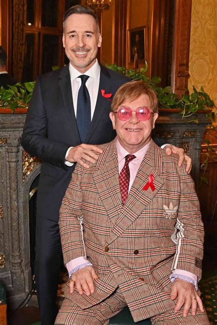 What does Elton John’s husband David Furnish do for a living?